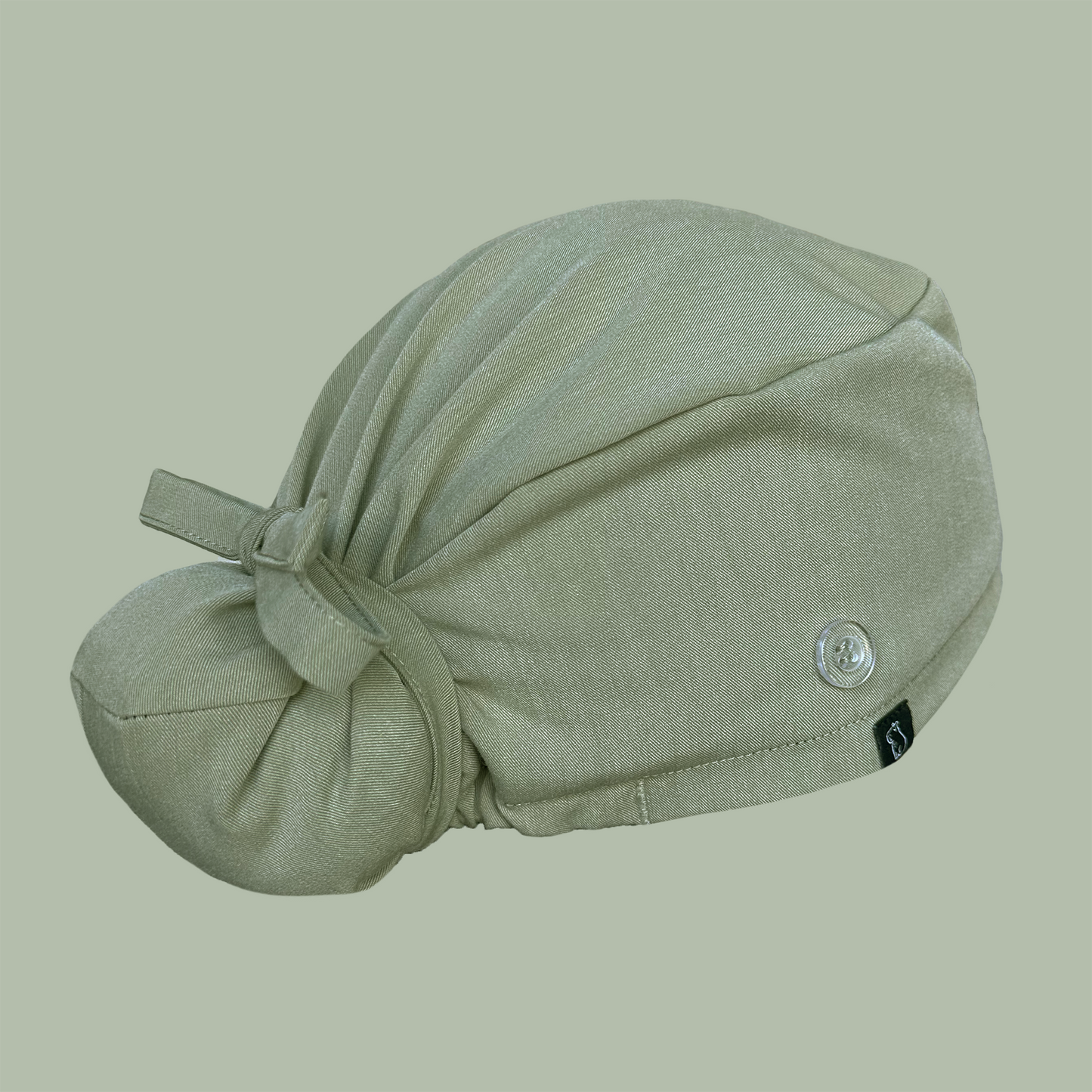 Bun cap in solid green rear view