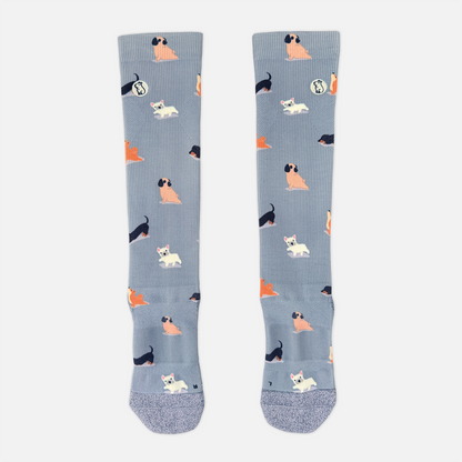 blue/purple compression sock with print featuring various dogs on light grey background