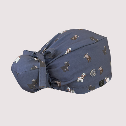 Rear view of navy blue Bun scrub cap with various goats