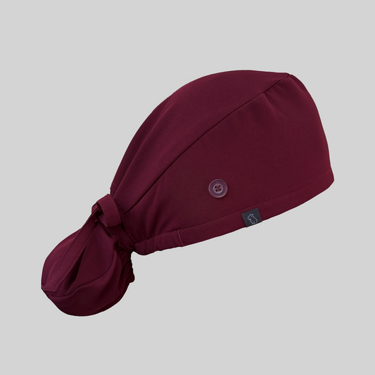 Maroon ponytail scrub cap from side view