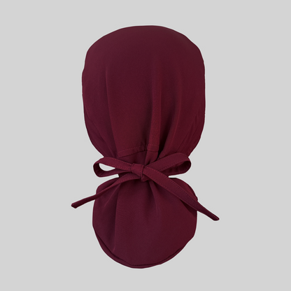 Maroon ponytail scrub cap from rear view