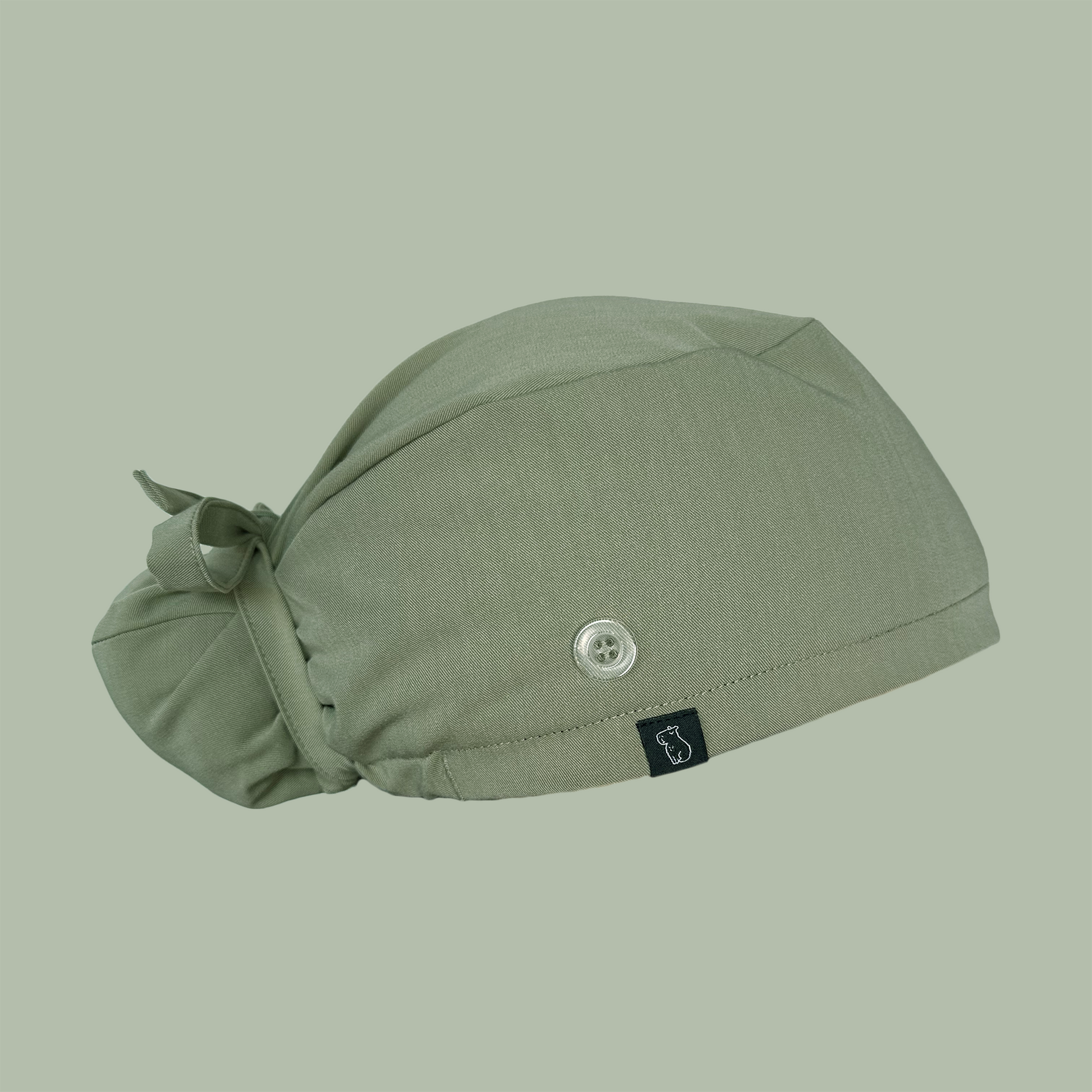 Bun cap in solid green side view