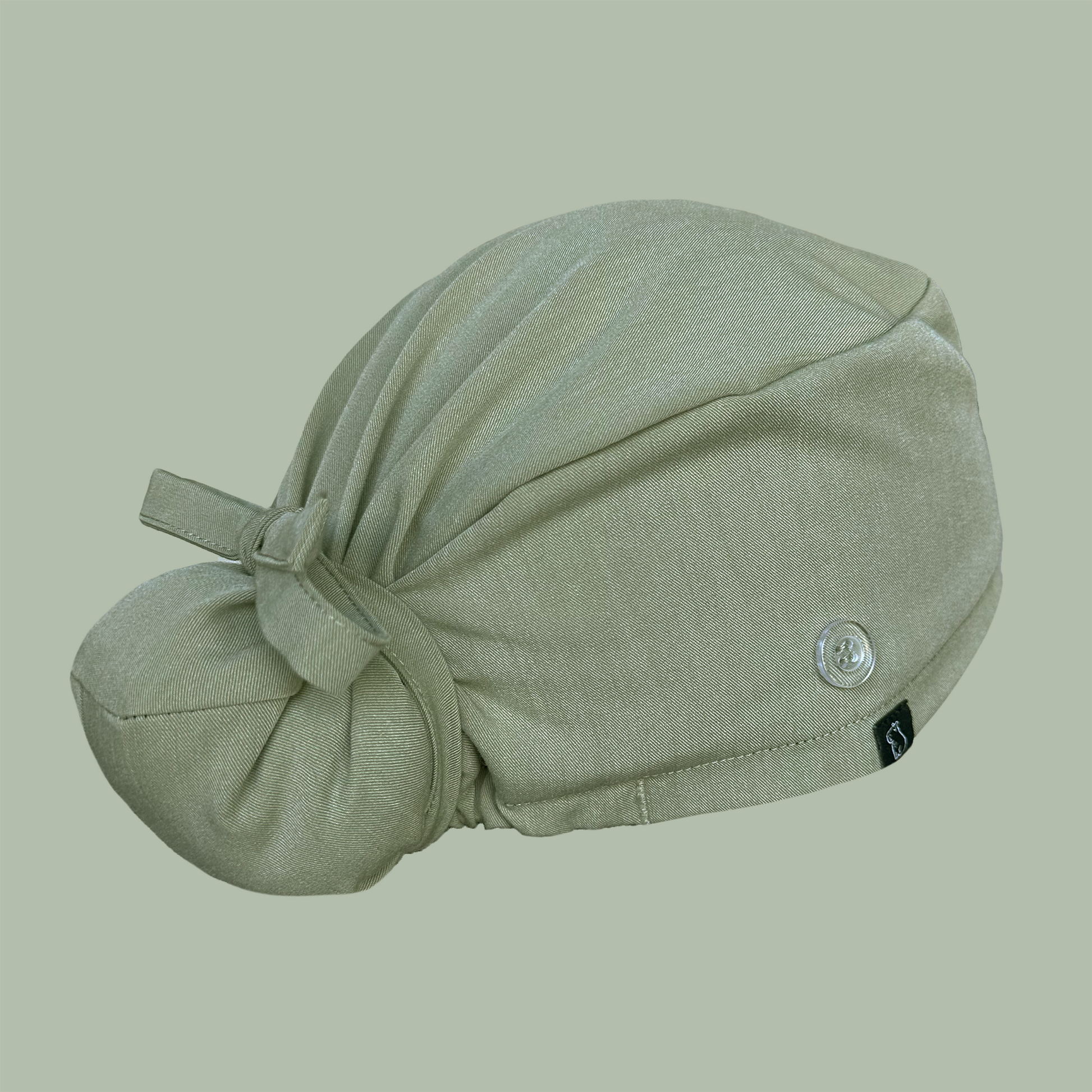Bun cap in solid green rear view