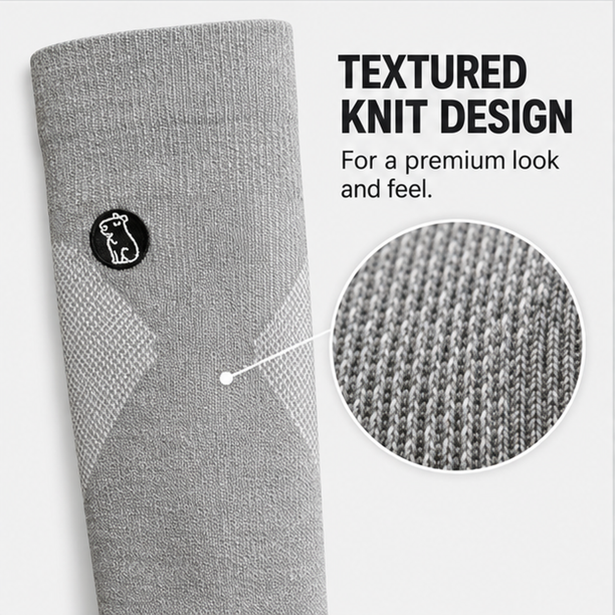 Close-up of the textured knit and capybara patch on Capy Heather Grey compression socks